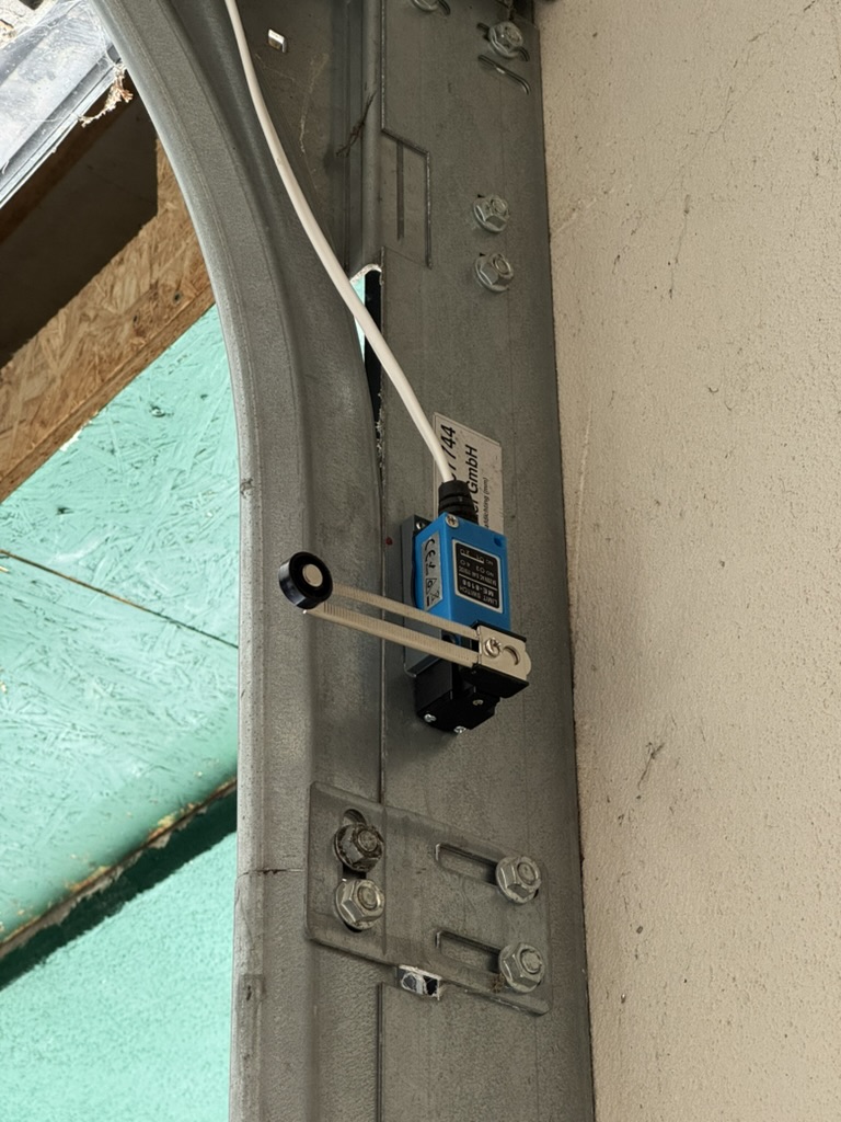 Limit switch installed at the bottom of the garage door